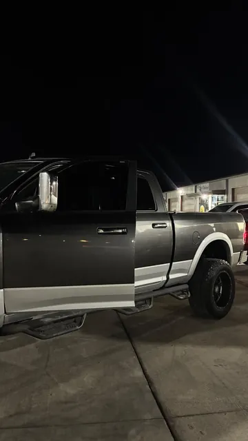 Pickup with tinted windows outside at night